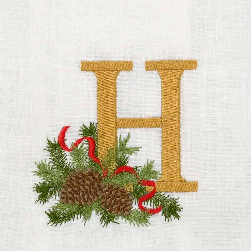 Arte Italica & Crown Linen Designs Winter Pine Monogram Towel H features gold embroidery and festive winter motif on linen, ideal for kitchen or bathroom elegance.