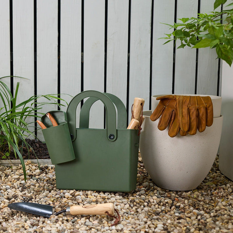 Hachiman | Garden Tool Bag Garden Green with tools and gloves on pebbles, ideal for container gardening, easy to clean, and perfect for outdoor use.