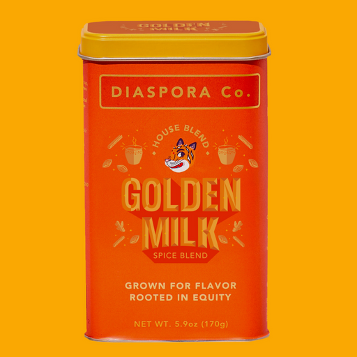 Diaspora Co. | Haldi Doodh (Golden Milk) Masala - Large tin featuring a cartoon tiger face, highlighting the vibrant spice blend for cooking enthusiasts.
