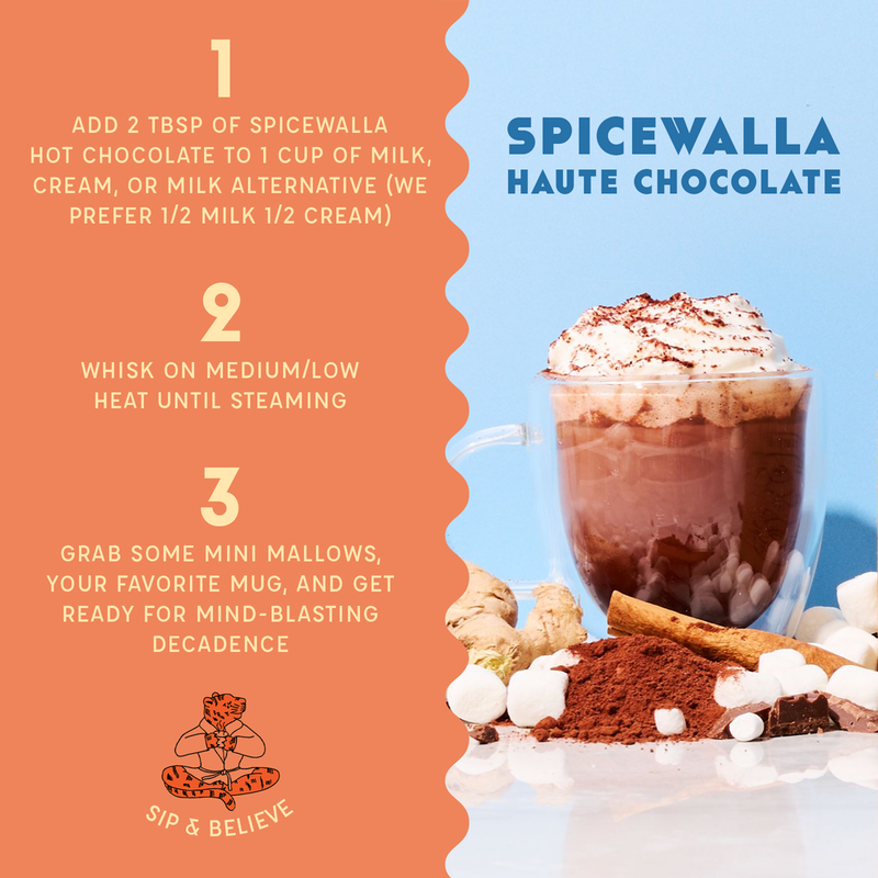 Spicewalla | Chai Spiced Hot Chocolate recipe card with a glass mug of hot chocolate topped with whipped cream, surrounded by cocoa, marshmallows, cinnamon, and ginger.