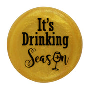 CapaBunga | Holiday Wine Caps - Santa Paws, featuring a yellow circular design with black text, ideal for festive wine bottle sealing.