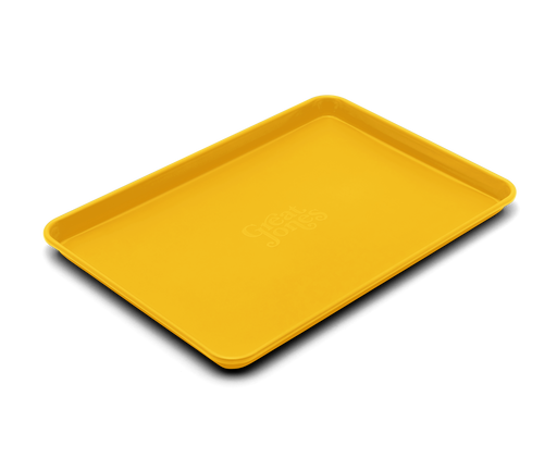 Great Jones | Holy Sheet - Pepper: A yellow, nonstick ceramic-coated half-sized sheet pan, ideal for baking and serving, reflecting Athens Cooks' curated kitchen essentials.
