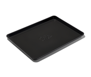 Great Jones | Holy Sheet - Pepper: Close-up of the nonstick ceramic-coated half-sized sheet pan, ideal for easy cleanup and stylish table presentation.