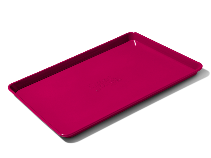 Great Jones | Holy Sheet - Pepper: A versatile half-sized sheet pan with nonstick ceramic coating for easy cleanup, ideal for both baking and serving.