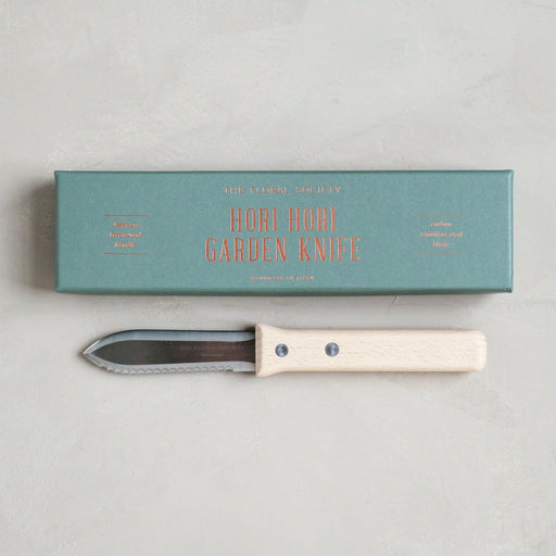 The Floral Society | Garden Tools - Potting Trowel, hand forged with boron steel, featuring an ash hardwood handle, ideal for planting and cultivating tasks.