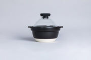 Hario GohanGama Glass Lid Rice Cooker, featuring a black and white design with a clear lid and whistle knob, ideal for stovetop use.