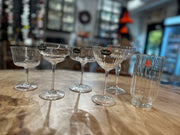 Bormioli | Vintage Mix Cocktail Glass Collection, Set of 6, featuring five coupe-style glasses and a ribbed tumbler, displayed on a wooden tabletop.