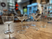 Bormioli | Vintage Mix Cocktail Glass Collection, Set of 6, featuring coupe-style and fluted glasses on a wooden countertop, displayed in a kitchen-wares shop.