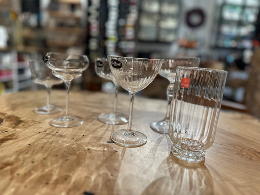 Bormioli | Vintage Mix Cocktail Glass Collection, Set of 6, featuring coupe-style glasses and a ribbed tumbler, arranged elegantly on a wooden table at Athens Cooks.