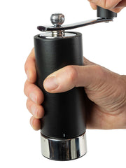 Peugeot | Isen Pepper Mill, Matte Black: Elegant hand-crank grinder with adjustable metal ring, featuring a wooden body and shiny metal handle for precise grinding.