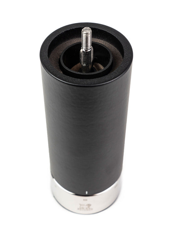 Peugeot | Isen Pepper Mill, Matte Black, shown upside-down revealing its grinding mechanism, chrome base, and u'Select control ring for adjusting grind size.