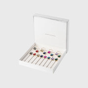Joanna Buchanan Party Set of Cocktail Picks and Wine Charms displayed in a jewelry box, ideal for entertaining, reflecting Athens Cooks' curated barware selection.