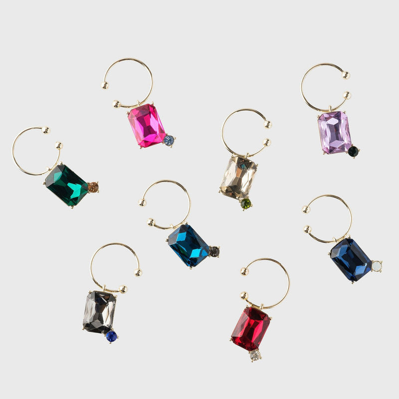 Joanna Buchanan Party Set featuring colorful gemstone cocktail picks and wine charms displayed on a gold hoop, ideal for enhancing barware collections.
