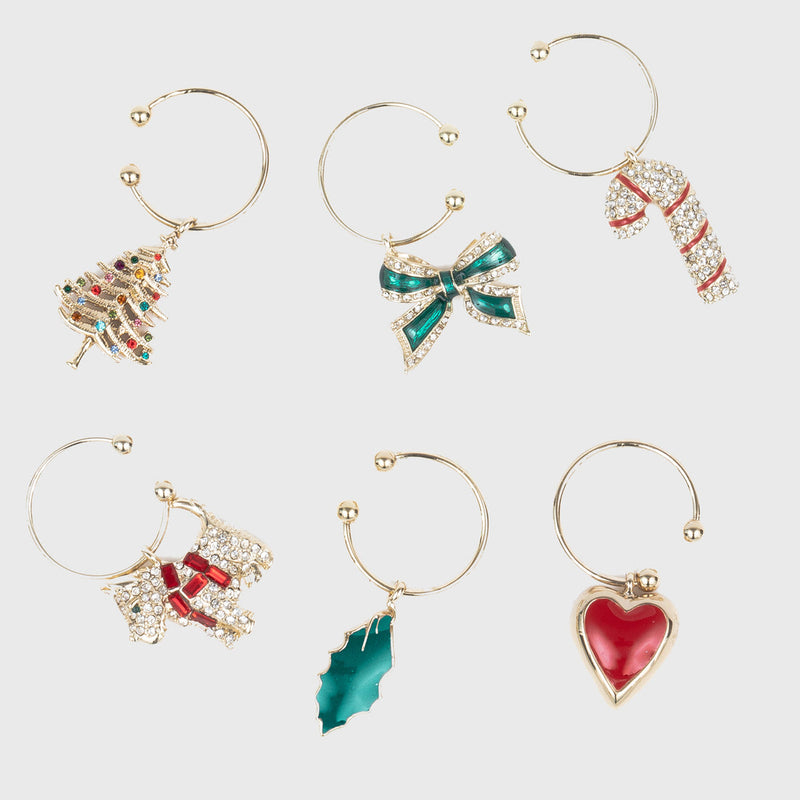 Joanna Buchanan Christmas Wine Charms displayed with ornaments, ideal for adding festive flair to your holiday table settings.