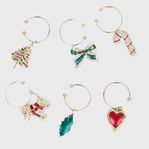 Joanna Buchanan Christmas Wine Charms displayed with ornaments, ideal for adding festive flair to your holiday table settings.