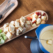 J.K. Adams Maple Appetizer Tray with fondue setup; includes baguette cubes, apple pieces, and fondue fork in cheese, showcasing elegant entertaining essentials from Athens Cooks.