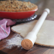 J.K. Adams | Lovely Rolling Pin, 24 Inches, on a floured board with dough, featuring a ¼″ thickness gauge for precise baking results.