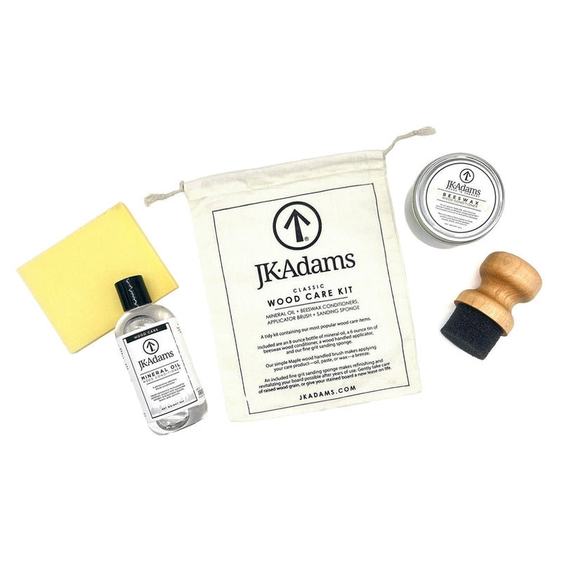 J.K. Adams Classic Wood Care Kit with mineral oil, beeswax tin, sanding sponge, foam applicator, and pouch for maintaining wood surfaces, sold at Athens Cooks.