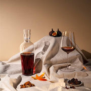 Richard Brendon | Jancis Robinson Mature Wine Decanter with a glass, highlighting its elegant design and mouth-blown stopper, perfect for sophisticated table settings.