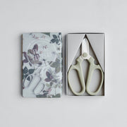 The Floral Society | Japanese Floral Clippers, Citrine, showcased in a grey box with packaging depicting foliage, ideal for precise flower and garden trimming.