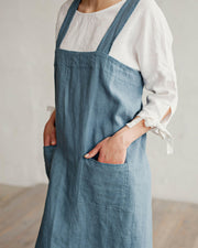 Japanese cross-back linen apron in woodrose, L-XL, with side pockets for cooking or gardening, blending style and functionality from Athens Cooks.