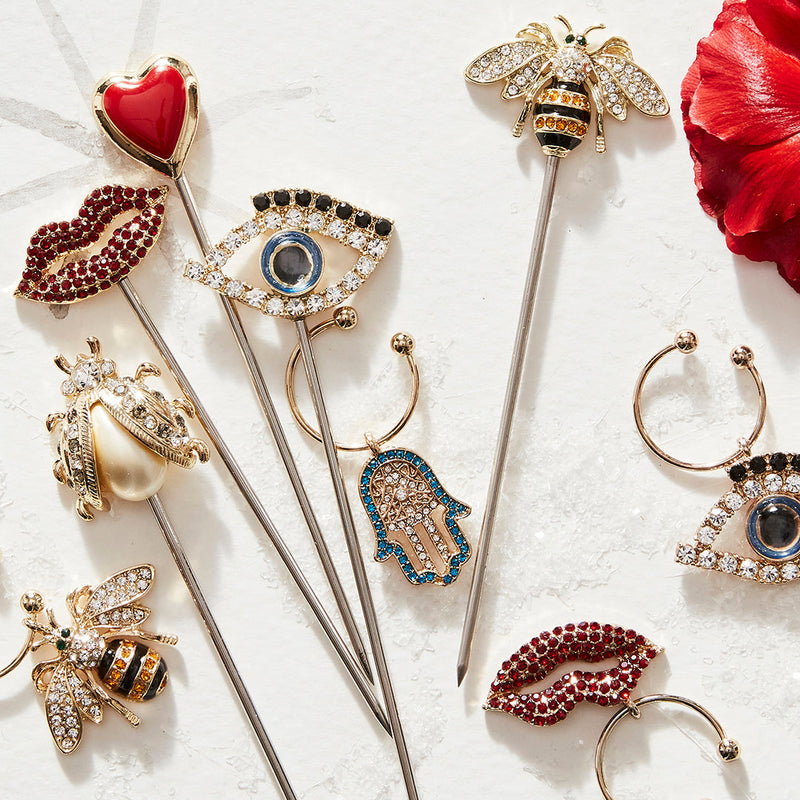 Joanna Buchanan | Cocktail Picks - Lucky Charm, showcasing elegant shell designs on stainless steel picks, perfect for cocktail garnishing, embodying coastal sophistication.