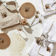 Joanna Buchanan | Bee Cocktail Picks, a set of six whimsical bee-themed picks on a towel, ideal for garnishing drinks, enhancing cocktail presentation.