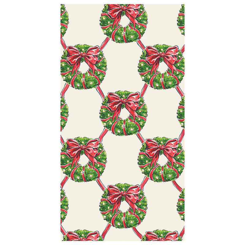 Hester & Cook Guest Napkin - Holiday Wreath features a pattern of green wreaths with red bows, perfect for festive gatherings.