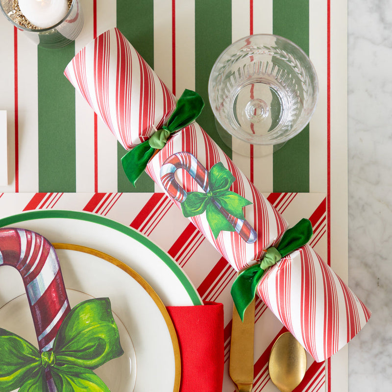 Hester & Cook | Christmas Crackers - Candy Cane feature festive honeycomb balls, confetti, gold crowns, and conversation cards, perfect for holiday celebrations.