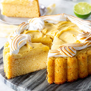 Nordic Ware | Charlotte Cake Pan showcasing a beautifully crafted cake with a slice removed, highlighting its 6-cup capacity, perfect for creating classic French desserts.