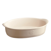Emile Henry large oval baking dish, crafted from Burgundy clay, ideal for casseroles and roasts, featuring handles and 3.6-quart capacity, perfect for versatile cooking.