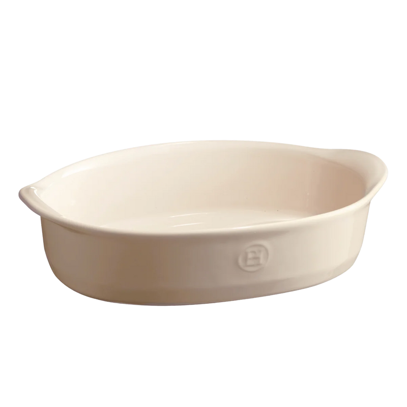 Emile Henry large oval baking dish, crafted from Burgundy clay, ideal for casseroles and roasts, featuring handles and 3.6-quart capacity, perfect for versatile cooking.