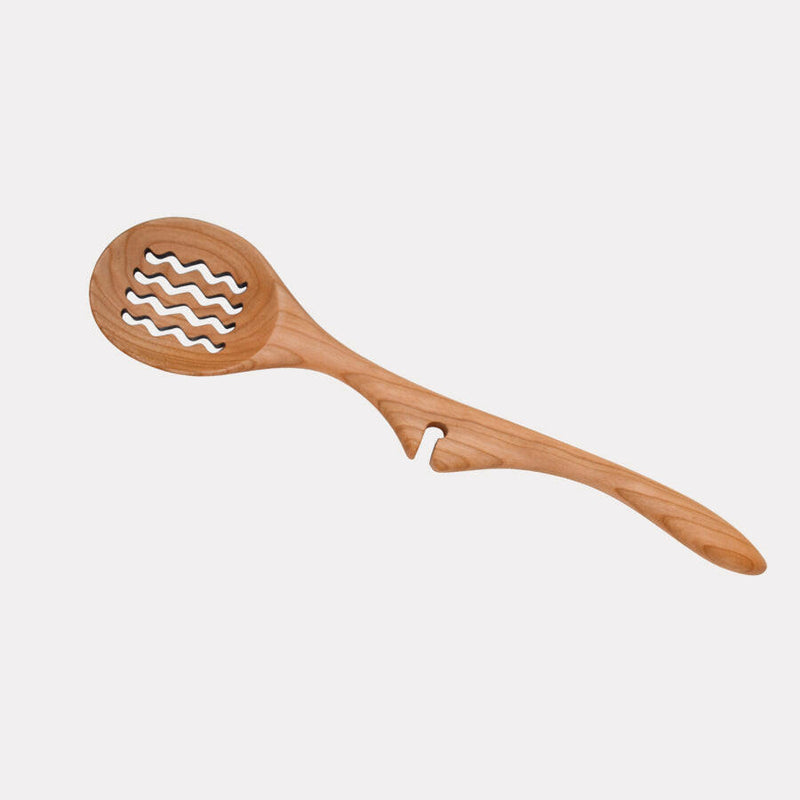 Jonathan's Spoons Lazy Spoon® Ladle, 13 cherry wood, elegantly rests on pots for mess-free serving, embodying Athens Cooks' dedication to quality kitchen tools.