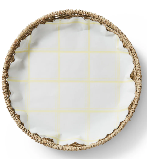 Lemon Chiffon Original Flat Plate Liners elegantly displayed in a basket, showcasing their durability and charm, ideal for enhancing table settings with compostable versatility.