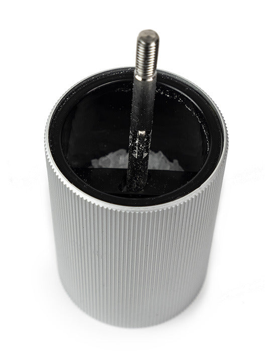 Peugeot | Line Salt Mill Aluminum + Beechwood 5 Inches, Natural, showcasing its interior with rock-salt crystals inside the cylindrical housing and central threaded shaft.