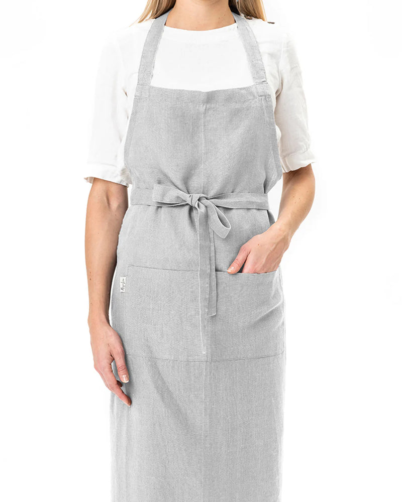 MagicLinen's Forest Green Linen Bib Apron, designed for kitchen and garden use, offers a unisex fit and a cozy, stone-washed texture.
