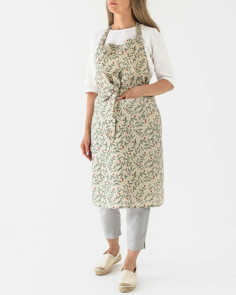 MagicLinen's Forest Green Bib Apron, crafted from durable linen, offers stylish protection for cooking and gardening, with a unisex fit for sizes XS to XL.