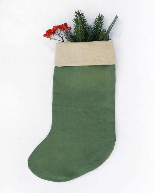 Handcrafted, sustainable linen Christmas stocking by MagicLinen, featuring double-layer design and hanging loop for festive decor. Perfect for eco-friendly holiday celebrations.