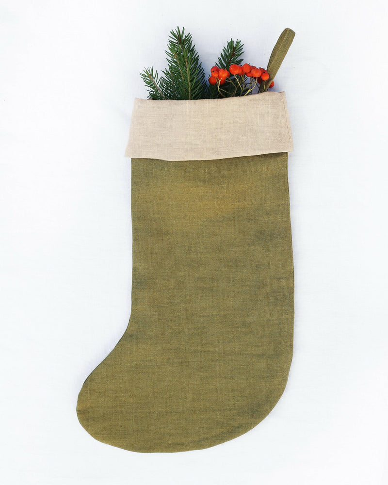MagicLinen Clay Red Christmas stocking in soft, natural linen with a double layer and hanging loop, showcasing sustainable, handcrafted holiday decor.