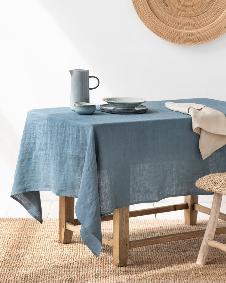 MagicLinen forest green linen tablecloth, 59 x 98 inches, with simple seam finish, ideal for versatile dining settings, from Athens Cooks kitchen store.
