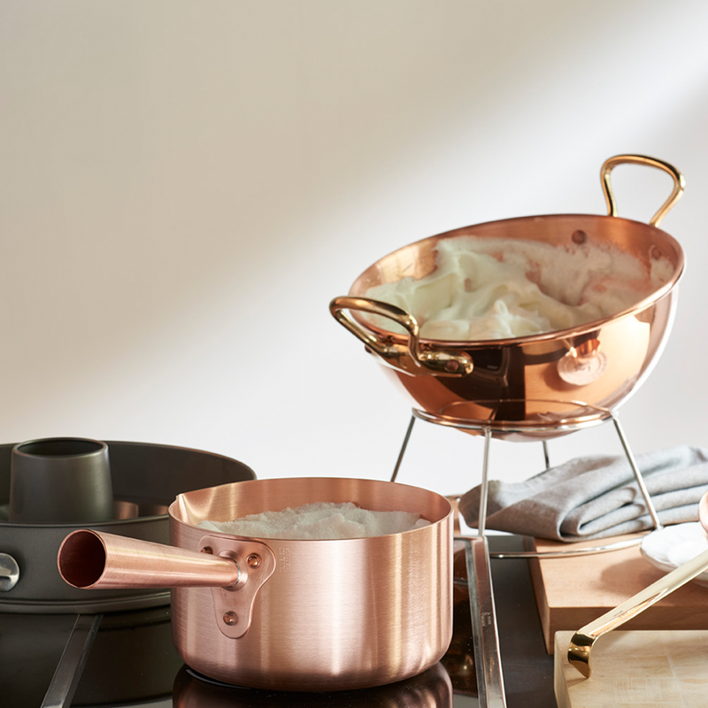 Mauviel | M'PASSION Copper Sugar Pan on stove, ideal for precise heat control in pastry tasks, showcased for Athens Cooks' curated kitchenware collection.