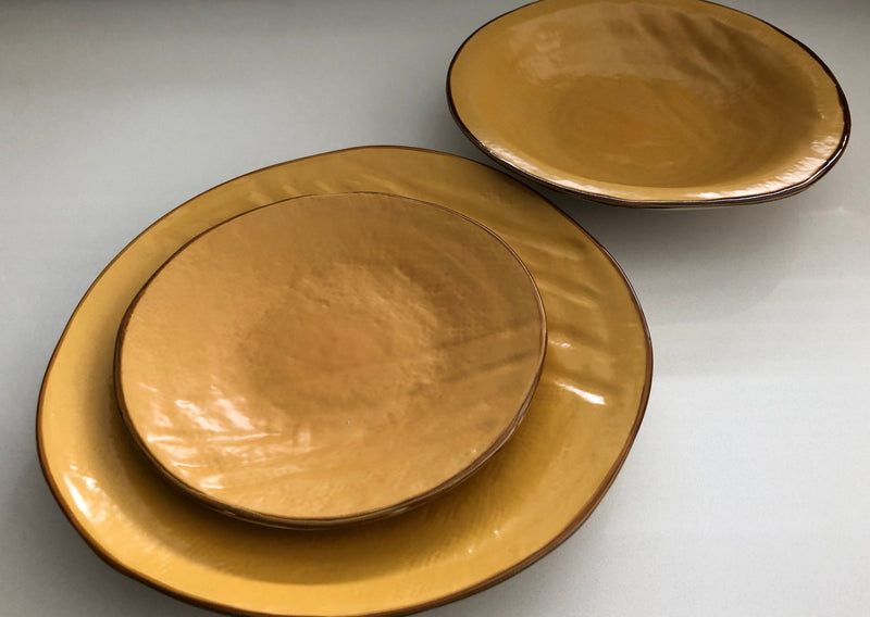 Close-up of a Novita | Mediterranean Stoneware Dinner Plate - Gray, showcasing its unique hand-dipped texture and craftsmanship, ideal for mixing and matching in elegant table settings.