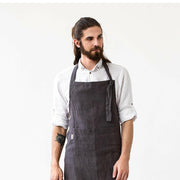 Men's Linen Bib Apron by MagicLinen in Charcoal Gray, featuring adjustable straps and a spacious twin-sectioned pocket, ideal for kitchen or gardening tasks.