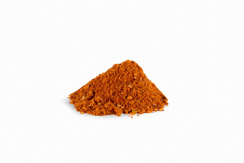 Spicewalla | Mom's Taco Seasoning: Finely ground reddish-orange spice blend for enhancing tacos and more, featuring chili, paprika, cumin, and garlic. Perfect for versatile, flavorful dishes.