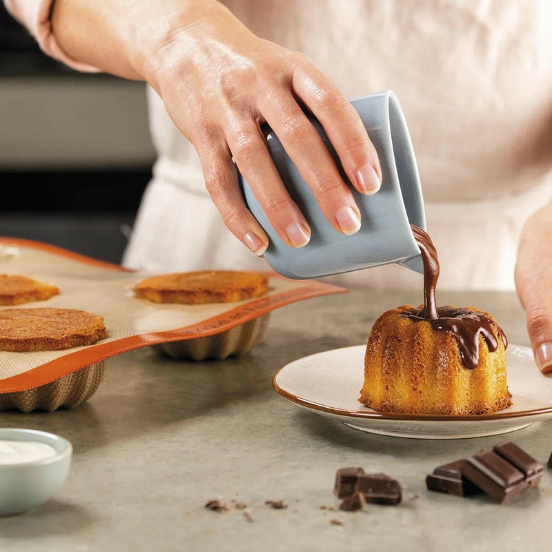 Silpat reusable silicone Tartelette Mold with 12 holes, designed for perfectly shaped pastries and quiches, ideal for enhancing baking precision.