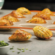 Silpat Reusable Silicone Baking Molds - Tartelette Mold, featuring 12 holes for perfectly shaped pastries, ideal for baking enthusiasts seeking durable, non-stick bakeware.