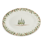 Arte Italica & Crown Linen Designs Natale Oval Platter featuring hand-painted evergreen garland, red berries, and pine trees; perfect for festive winter table settings.