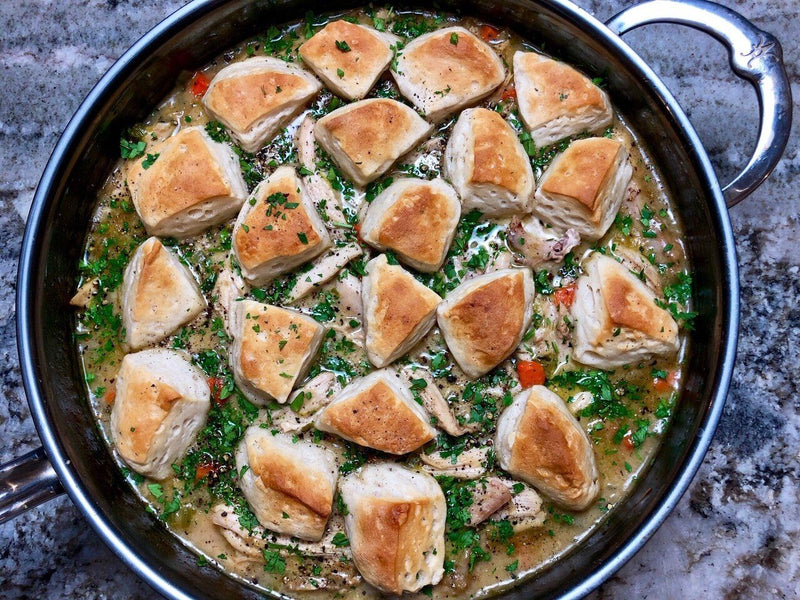 Hestan NanoBond 5qt Sauté Pan with Lid showcasing one-pot chicken and dumplings, highlighting its wide surface and advanced durability for superior cooking performance.