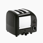 Dualit | 2 Slice Classic Toaster, Matt Black features a sleek stainless-steel design with black side panels and a browning control knob, ideal for precise toasting.