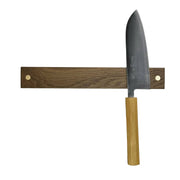 Rune-Jakobsen Design | '2-DOTS' Knife Holder with Brass Details - Fumed oak - 16, showcasing a cleaver on a wooden magnetic rail with elegant brass accents.